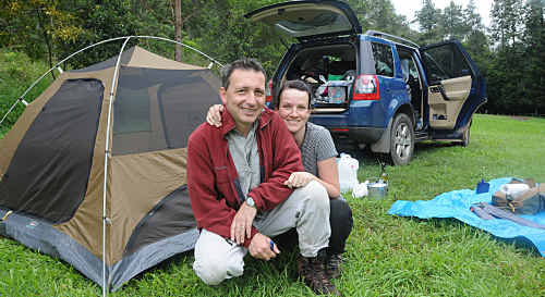 Dimitri and Anna Govor from Sydney get ready to pack up from a wet Glastonbury Creek camping area in Brooyar State Forest; they welcomed the cool change rain brought to the region. Dimitri and Anna Govor from Sydney get ready to pack up from a wet Glastonbury Creek camping area in Brooyar State Forest; they welcomed the cool change rain brought to the region.